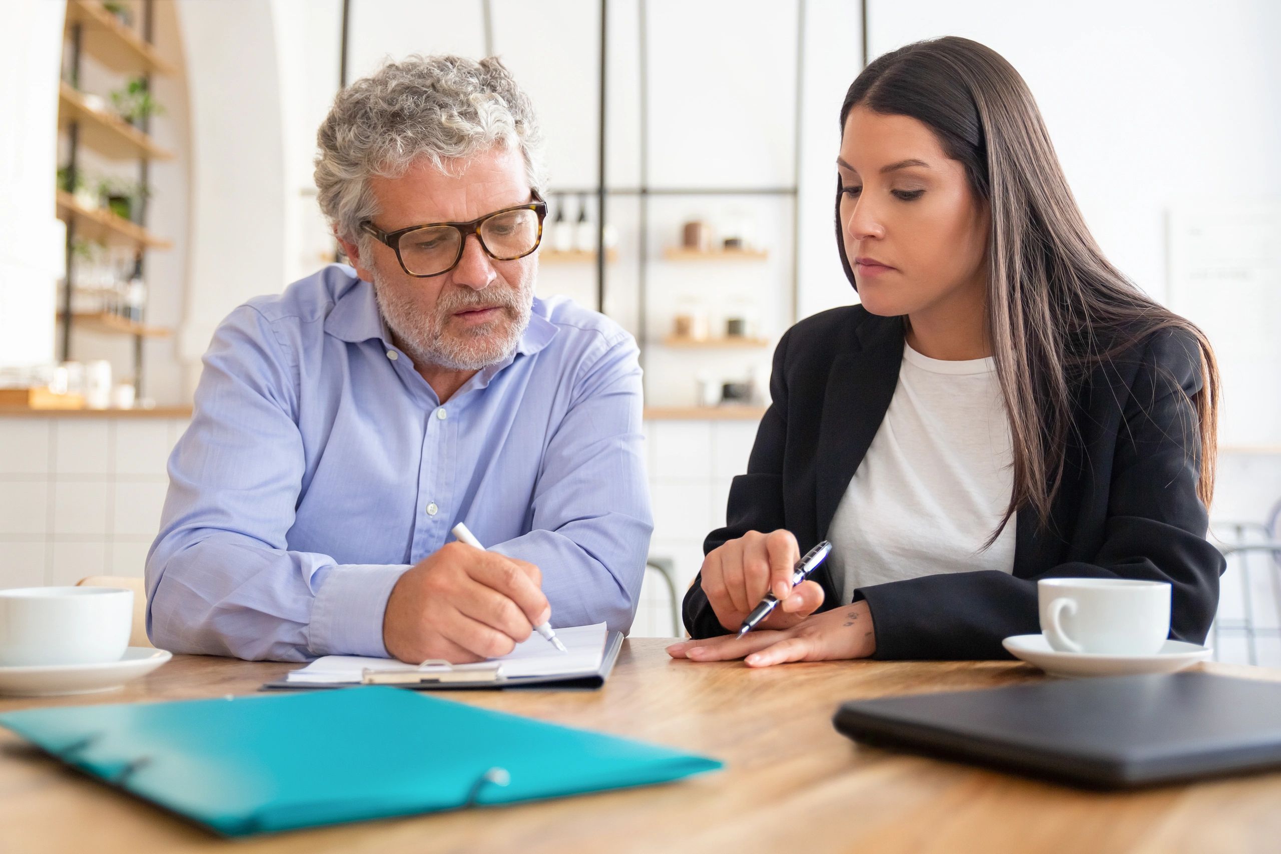 Business owner reviewing website project details